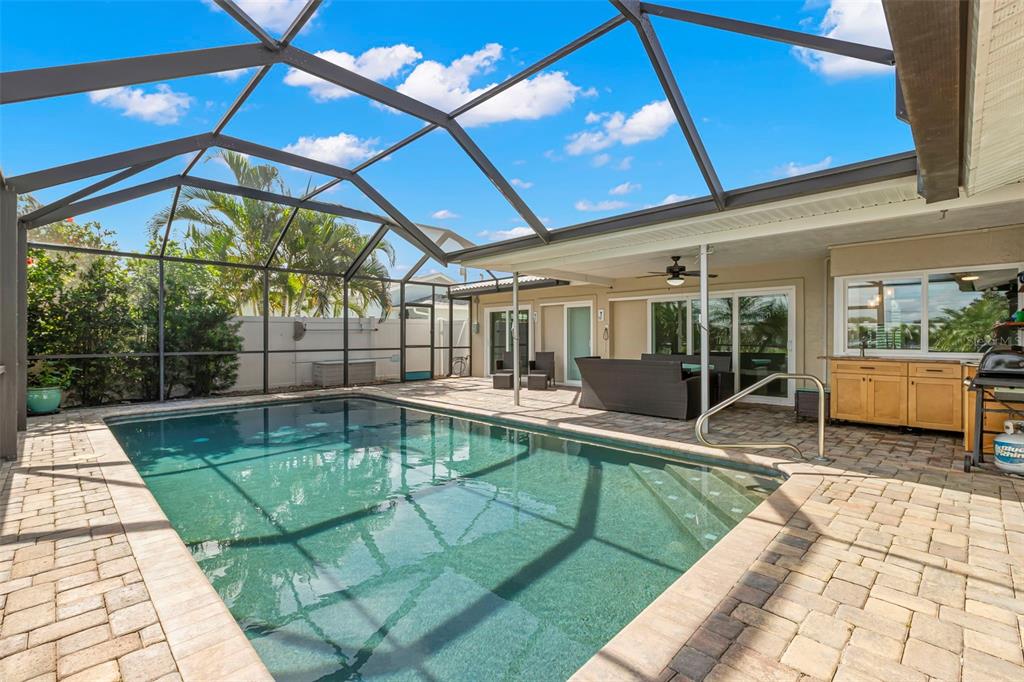 4003 Headsail Drive New Port Richey, FL 34652 - Photo 20 of 50 a view of a patio with swimming pool table and chairs