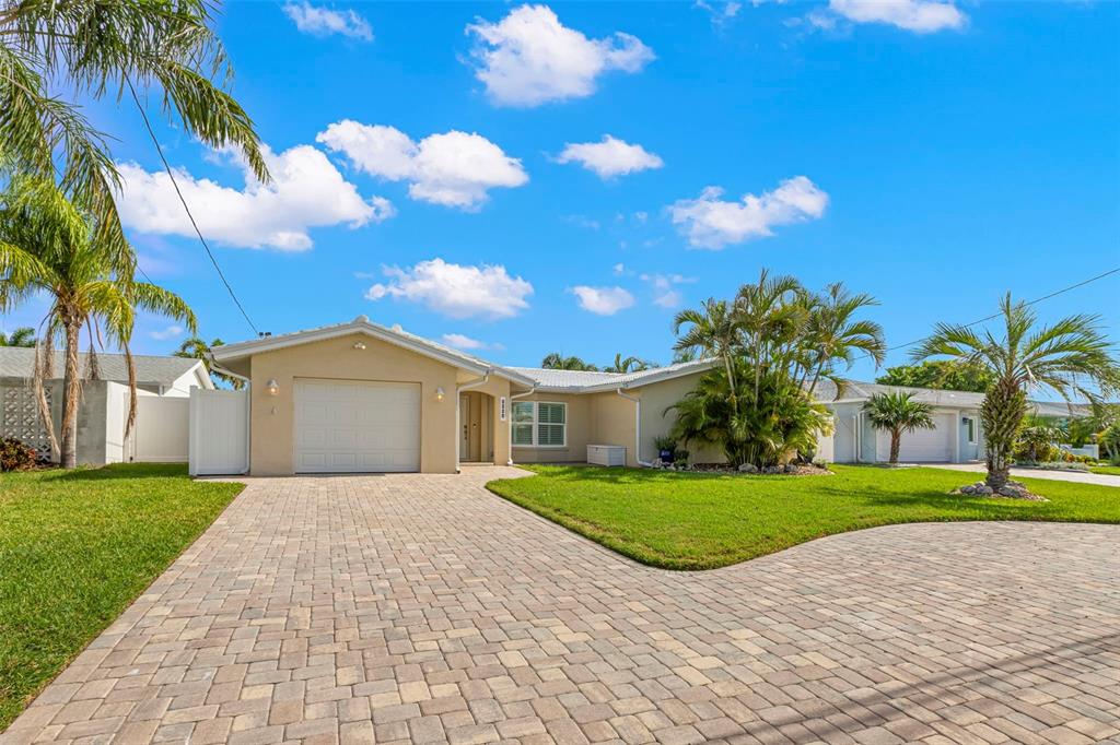 4003 Headsail Drive New Port Richey, FL 34652 - Photo 2 of 50 a front view of a house with a yard and garage