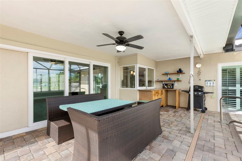 4003 Headsail Drive New Port Richey, FL 34652 - Photo 21 of 50 a living room with granite countertop furniture a fireplace and a chandelier