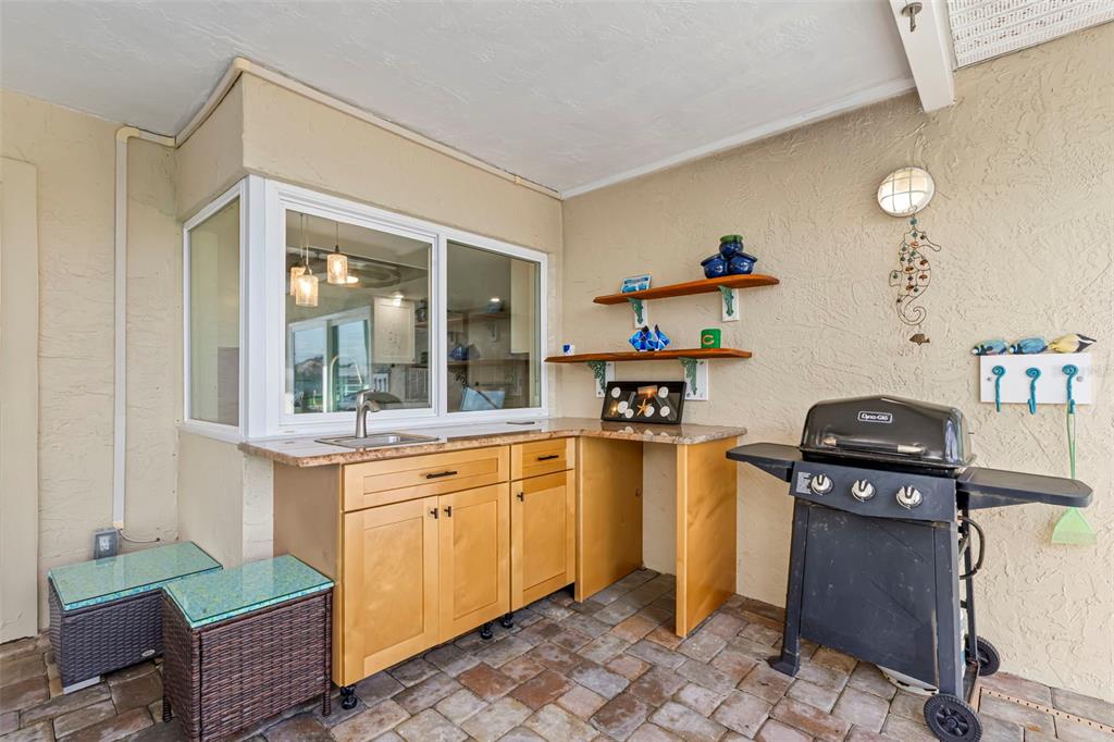 4003 Headsail Drive New Port Richey, FL 34652 - Photo 22 of 50 a kitchen with a sink stove and refrigerator