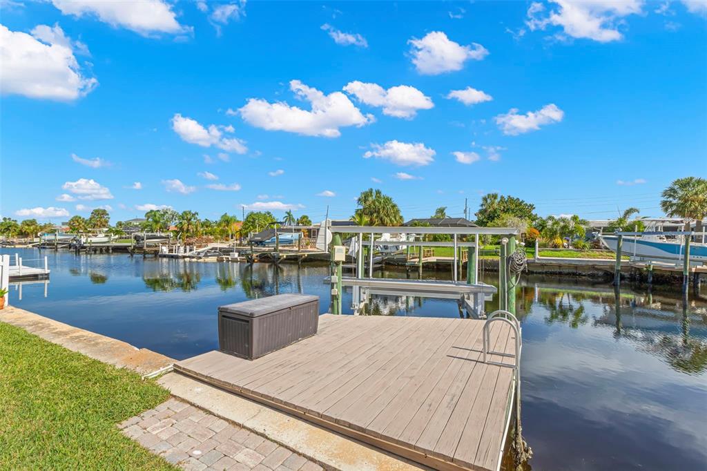 4003 Headsail Drive New Port Richey, FL 34652 - Photo 24 of 50 a view of a lake with couches and city view