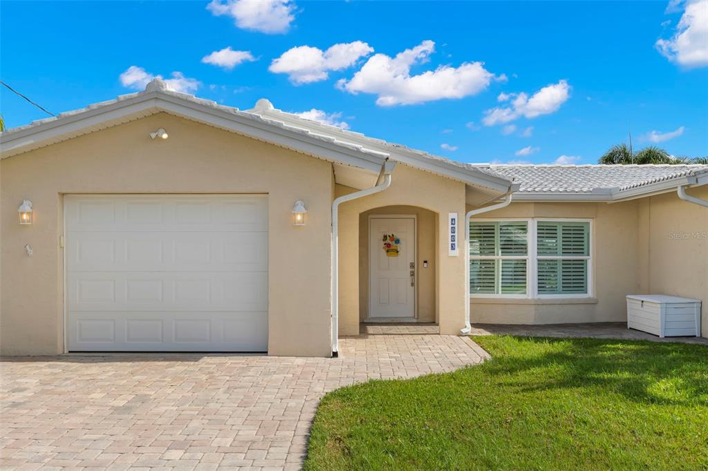 4003 Headsail Drive New Port Richey, FL 34652 - Photo 3 of 50 a front view of a house with a garden and yard