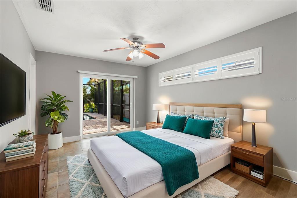 4003 Headsail Drive New Port Richey, FL 34652 - Photo 34 of 50 a bedroom with a large bed and a window