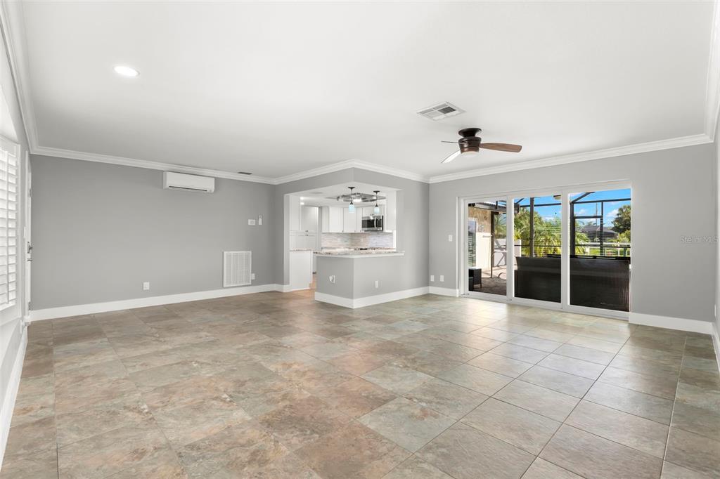 4003 Headsail Drive New Port Richey, FL 34652 - Photo 6 of 50 a view of an empty room with furniture and a kitchen