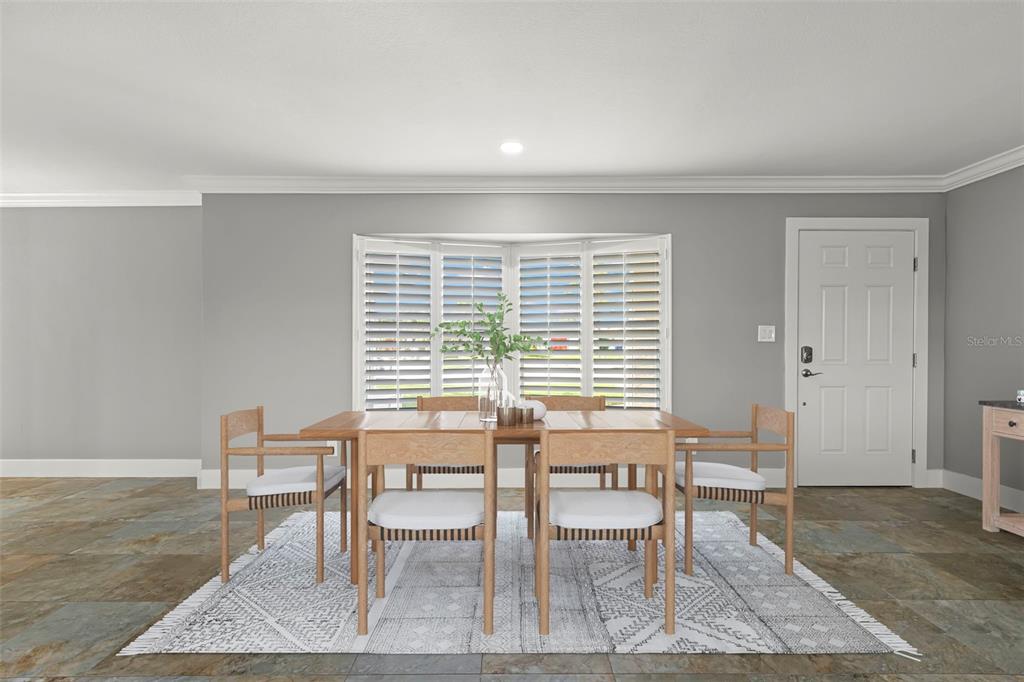 4003 Headsail Drive New Port Richey, FL 34652 - Photo 10 of 50 a dining room with wooden floor and a rug