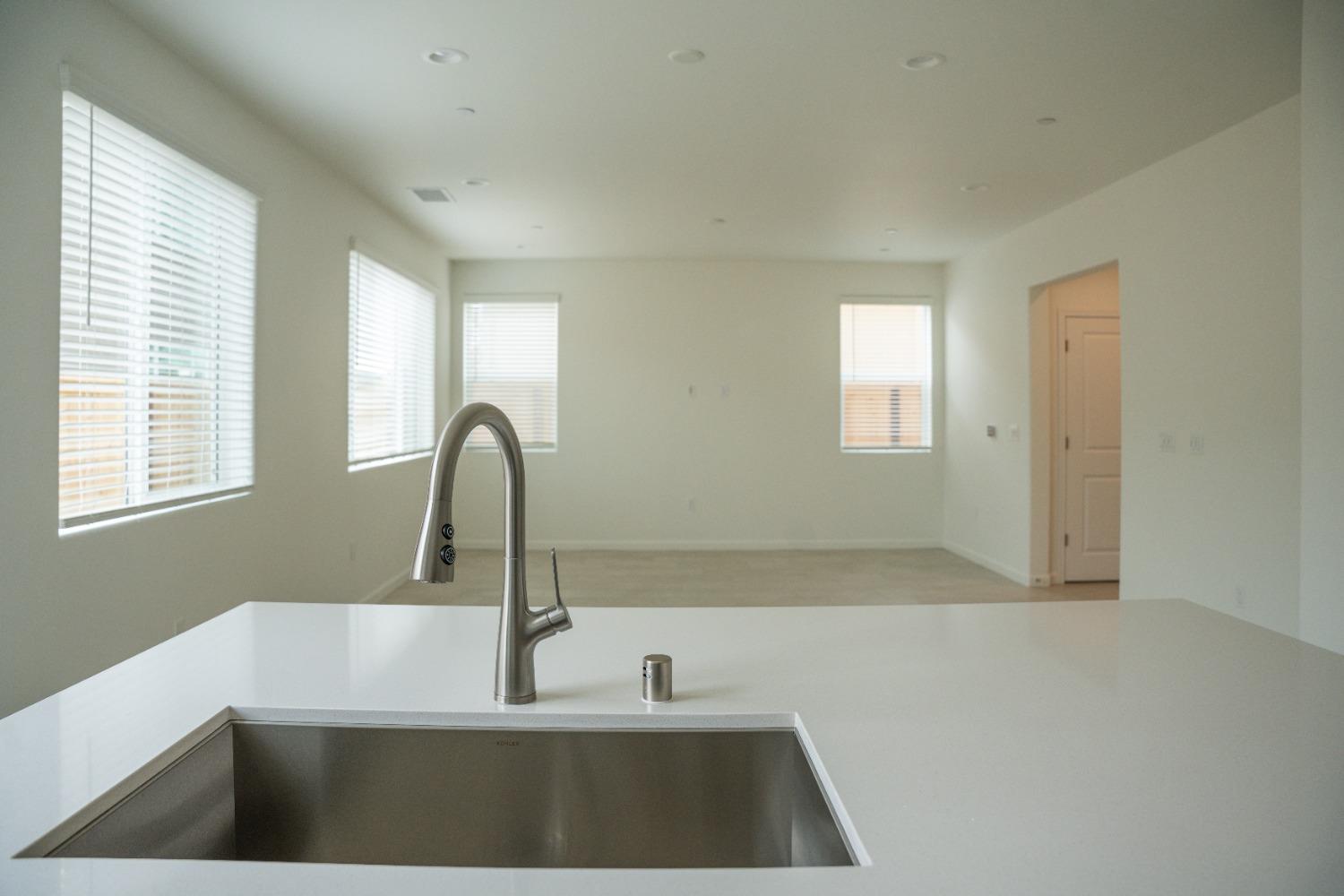 694 Thomas Way Madera, CA 93636 - Photo 8 of 27 a kitchen with a sink and a window