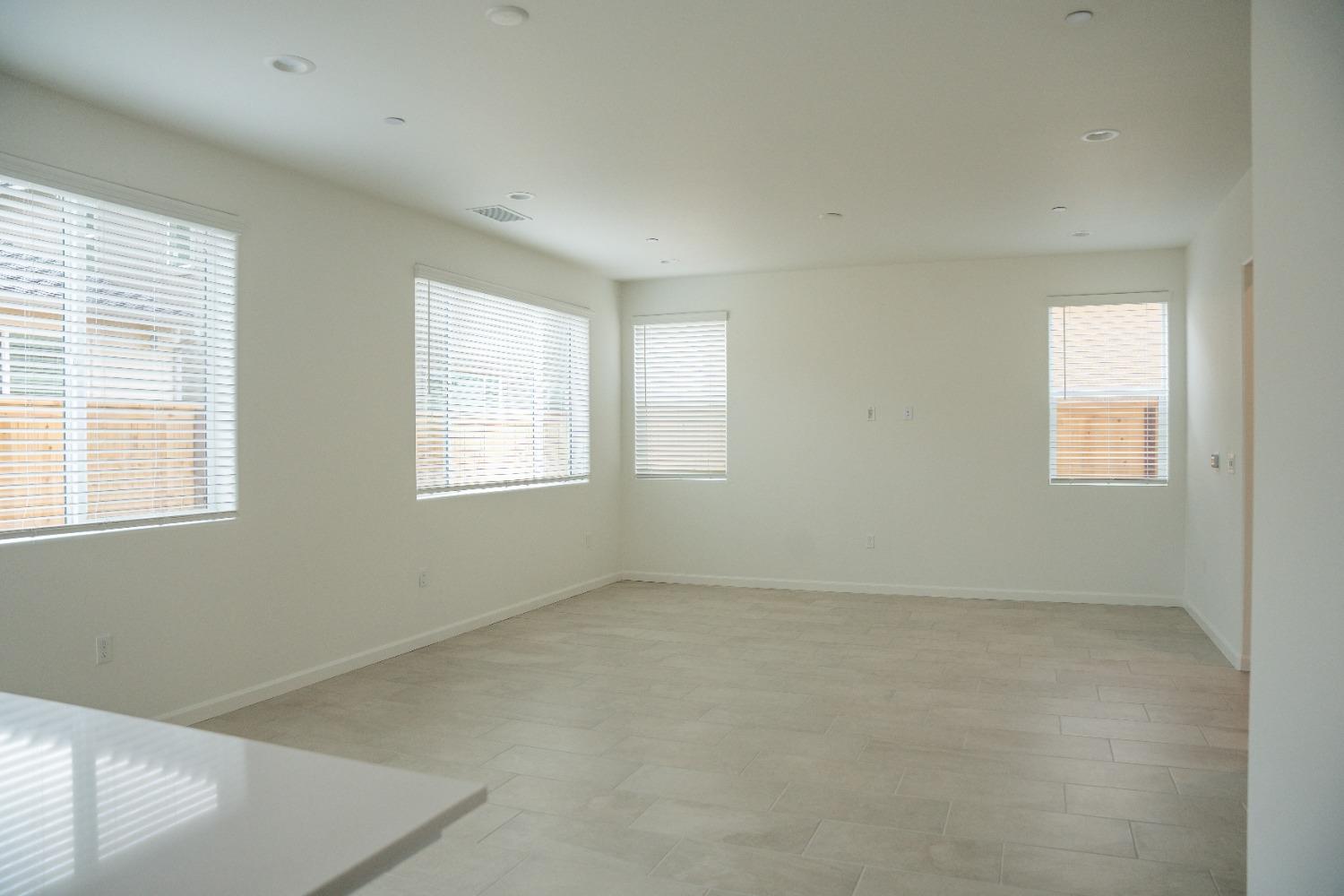 694 Thomas Way Madera, CA 93636 - Photo 9 of 27 a view of an empty room with a window