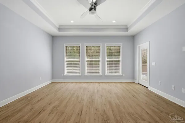 a view of room with window and ceiling fan