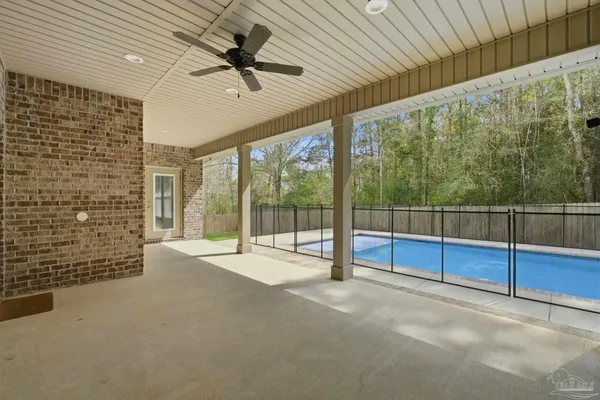 a view of an empty room with windows