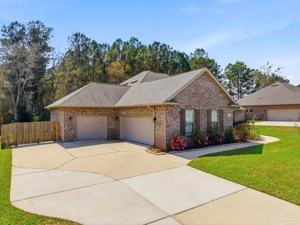 an aerial view of a house with swimming pool