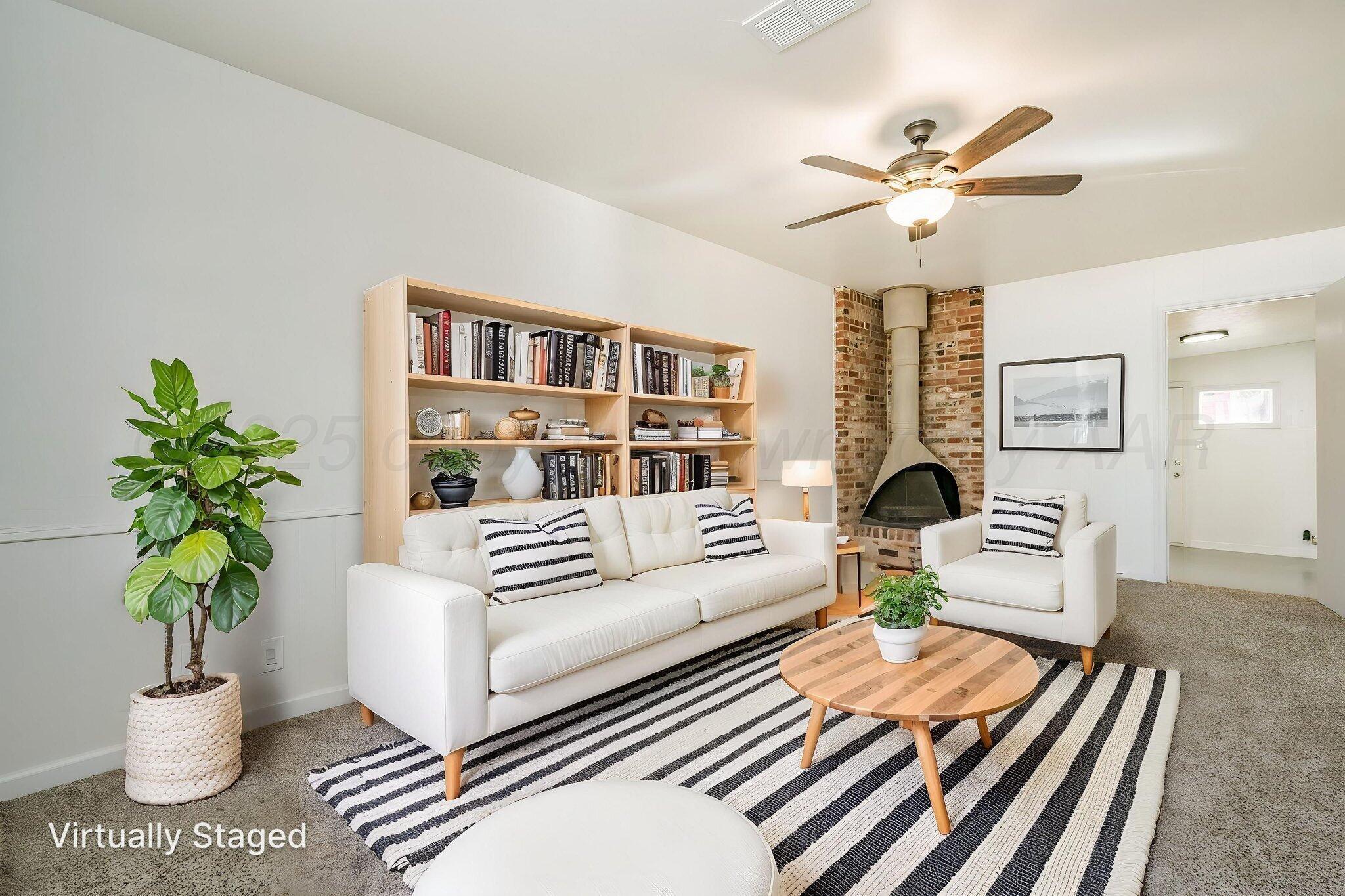 2115 South Hayden Street Amarillo, TX 79109 - Photo 12 of 27 a living room with furniture and a potted plant