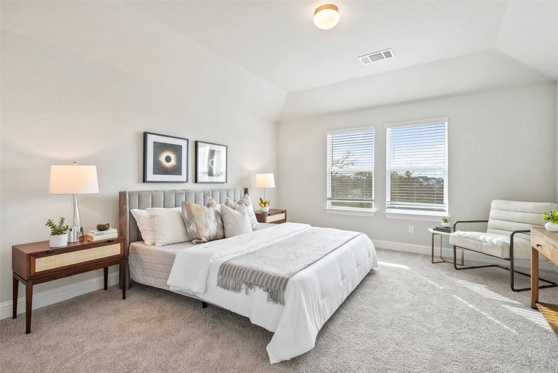 113 Stone Cyn Drive Georgetown, TX 78628 - Photo 17 of 35 a bedroom with a bed and a couch