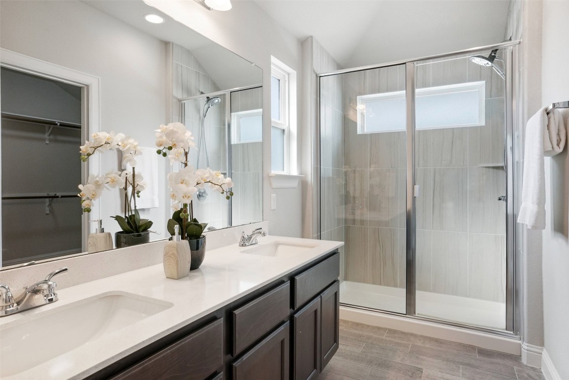 113 Stone Cyn Drive Georgetown, TX 78628 - Photo 20 of 35 a bathroom with a double vanity sink mirror and shower