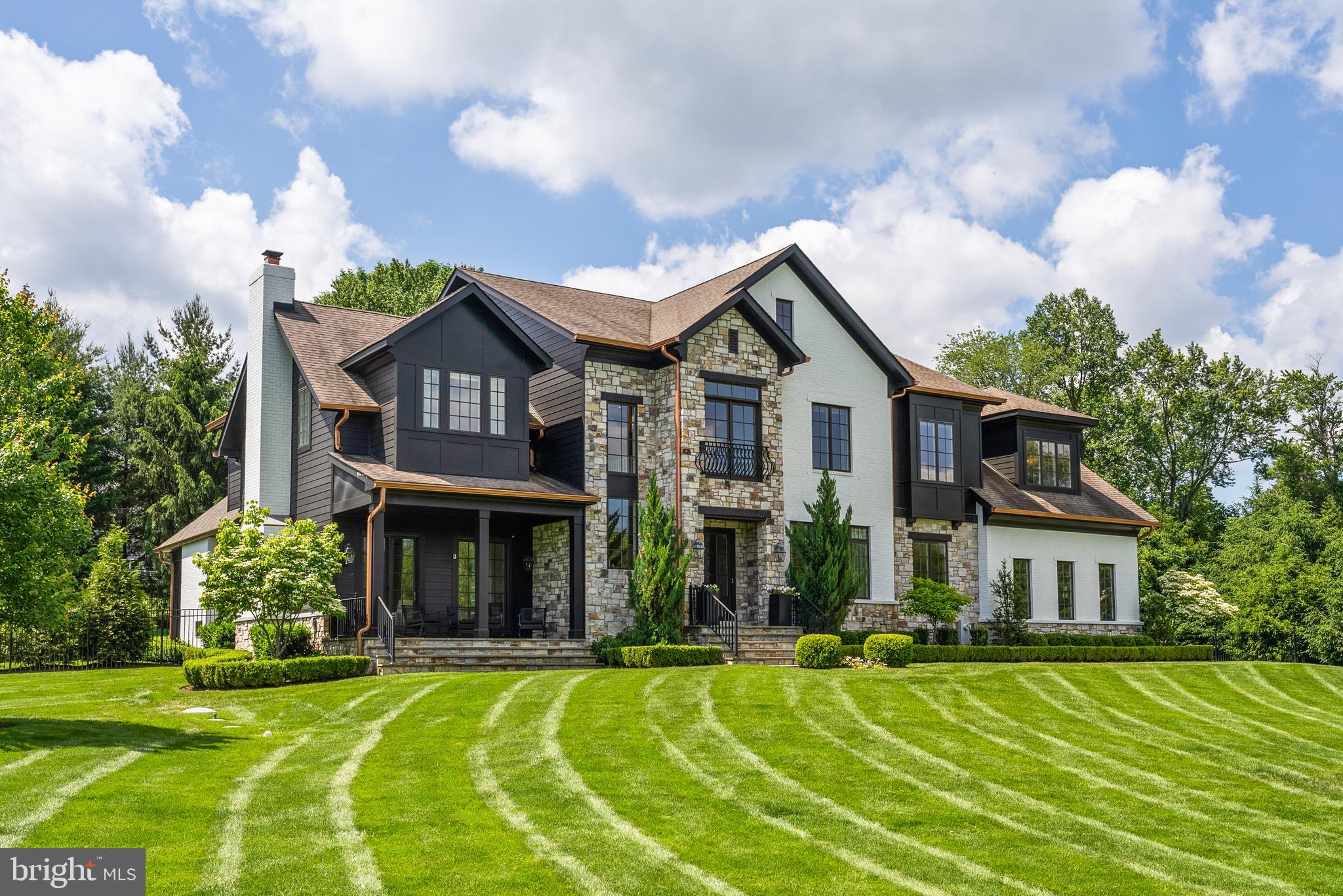 a front view of a house with a yard table and chairs