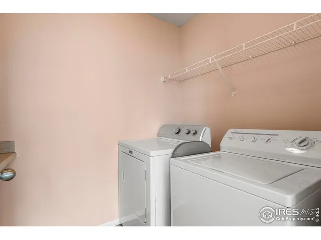 a bathroom with a granite countertop sink toilet a mirror and shower