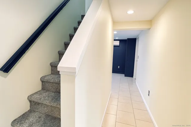 a bedroom with a bed and a view of bathroom