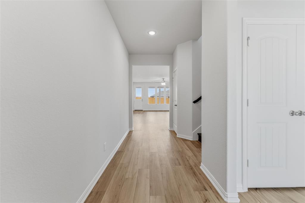 2012 Velora Drive Haslet, TX 76052 - Photo 5 of 33 a view of a hallway with wooden floor
