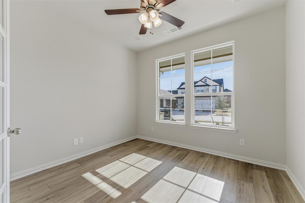 2012 Velora Drive Haslet, TX 76052 - Photo 8 of 33 wooden floor in an empty room with a window