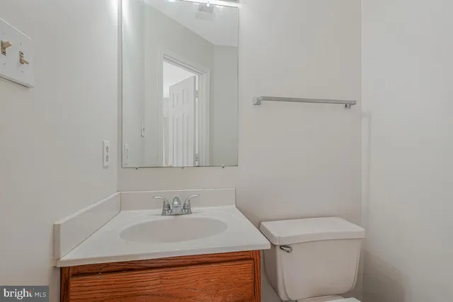a bathroom with a sink toilet and vanity