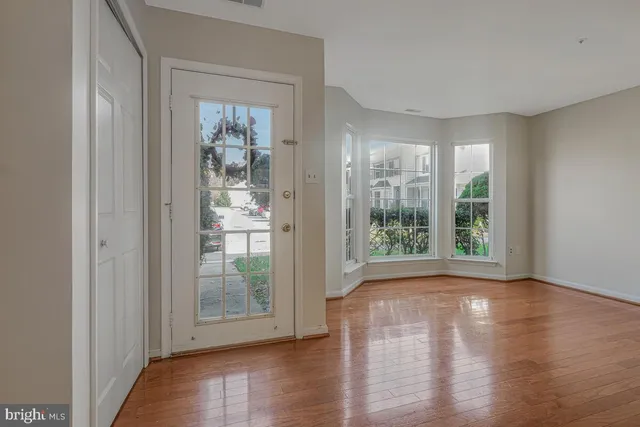 a view of a room with wooden floor and walls