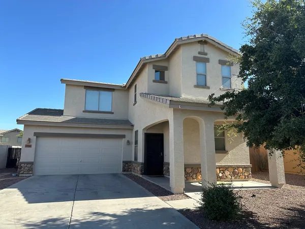 a front view of a house with a garage