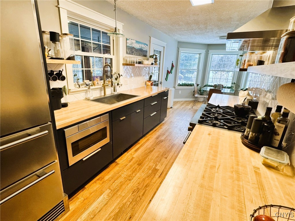 134 Sincerbeaux Road Groton, NY 13073 - Photo 13 of 49 Kitchen with Forno Stove and Refrigerator