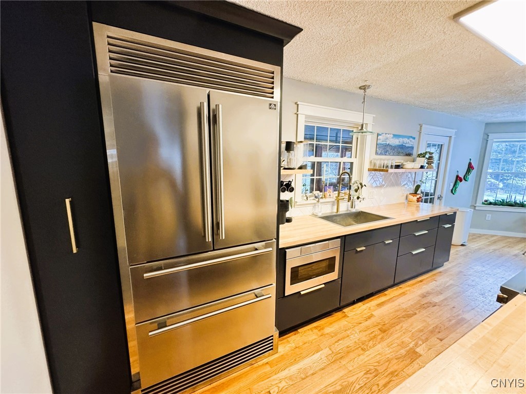 134 Sincerbeaux Road Groton, NY 13073 - Photo 14 of 49 Kitchen with Forno Stove and Refrigerator