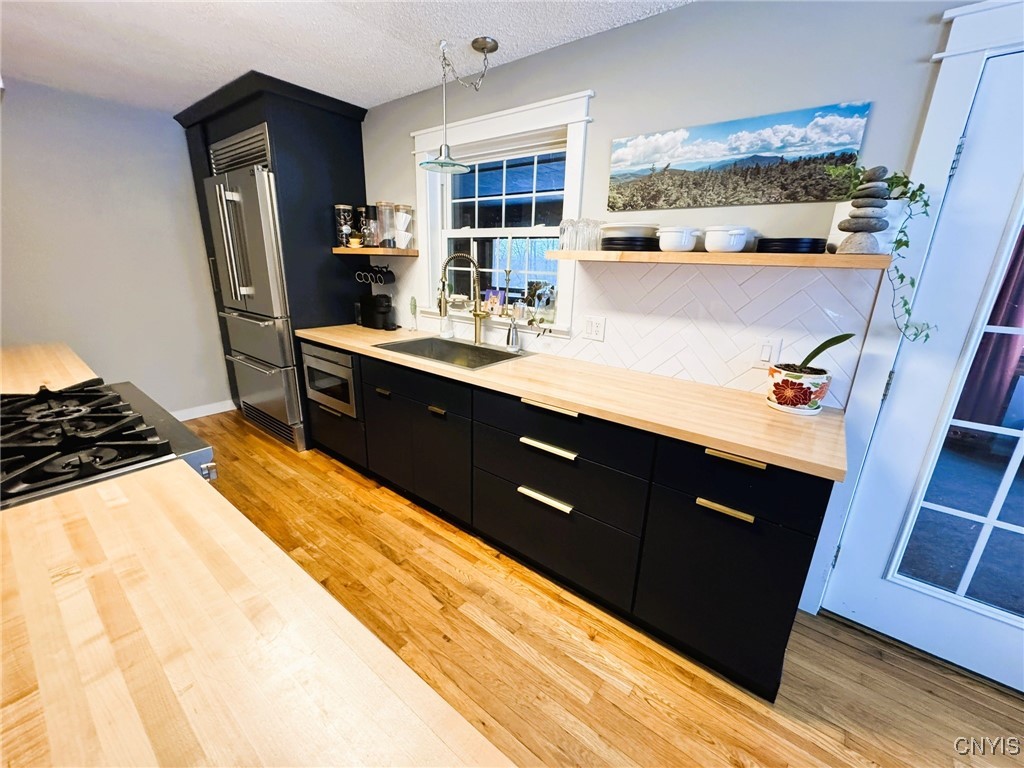 134 Sincerbeaux Road Groton, NY 13073 - Photo 16 of 49 Kitchen with Forno Stove and Refrigerator