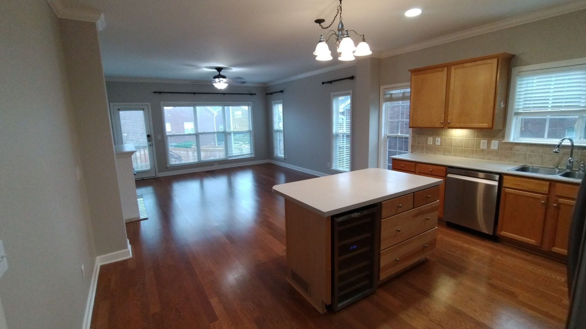 1308 Decatur Circle Franklin, TN 37067 - Photo 5 of 20 a kitchen with stainless steel appliances granite countertop a sink dishwasher a stove and a large refrigerator with wooden floor