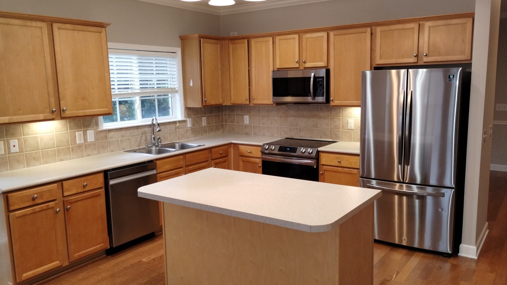 1308 Decatur Circle Franklin, TN 37067 - Photo 7 of 20 a kitchen with granite countertop a sink stainless steel appliances and window