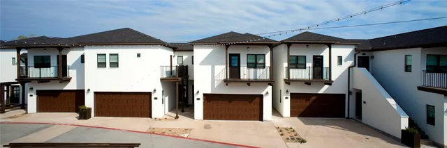 a front view of a house with parking