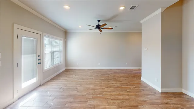 wooden floor in an empty room with a window