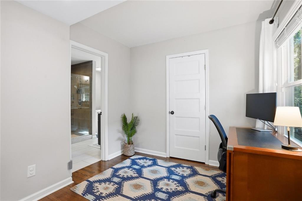 1430 Thomas Road Decatur, GA 30030 - Photo 18 of 42 a view of a workspace with furniture and wooden floor