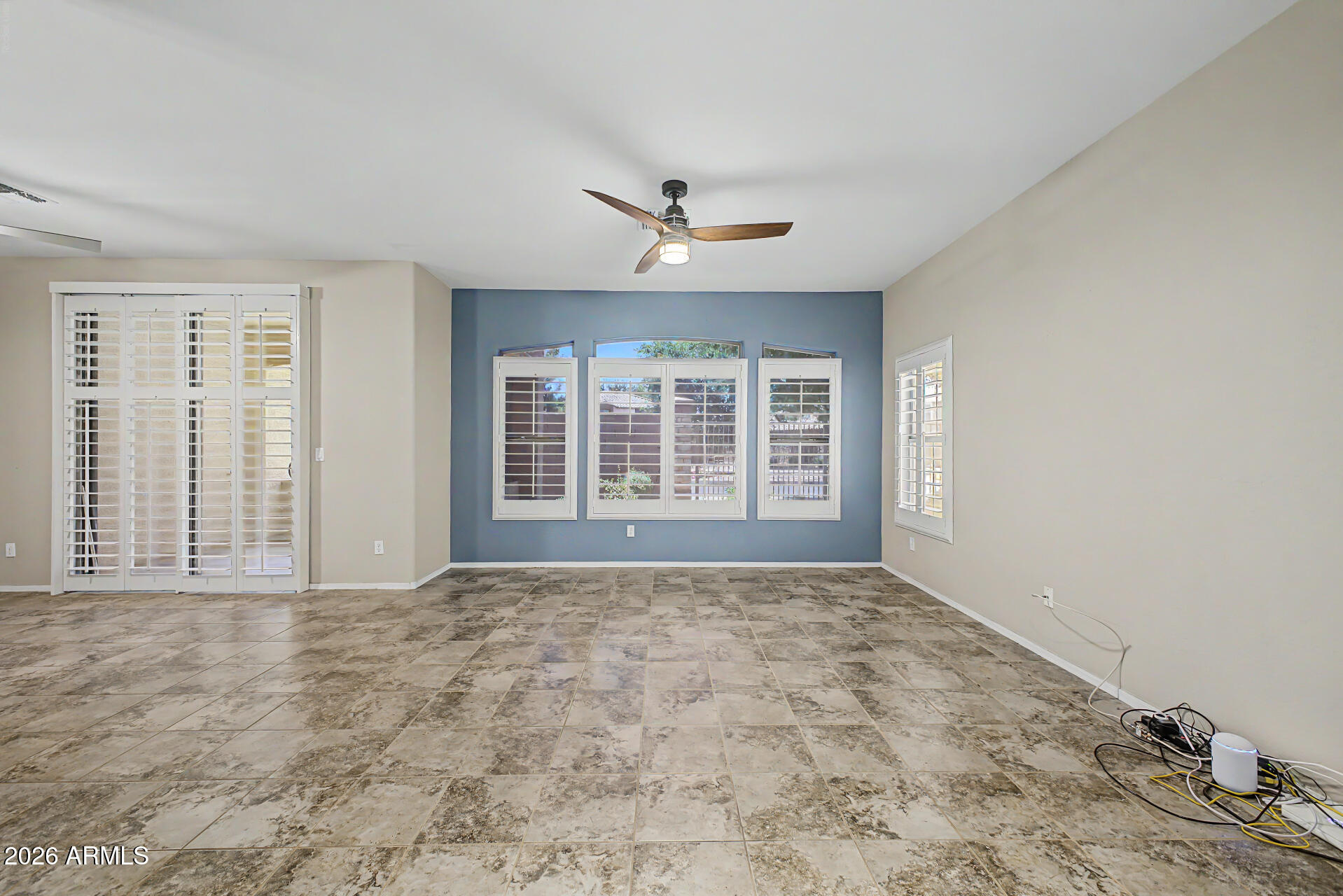 2600 East Springfield Place, Unit 109 Chandler, AZ 85286 - Photo 7 of 38 a view of an empty room with a window