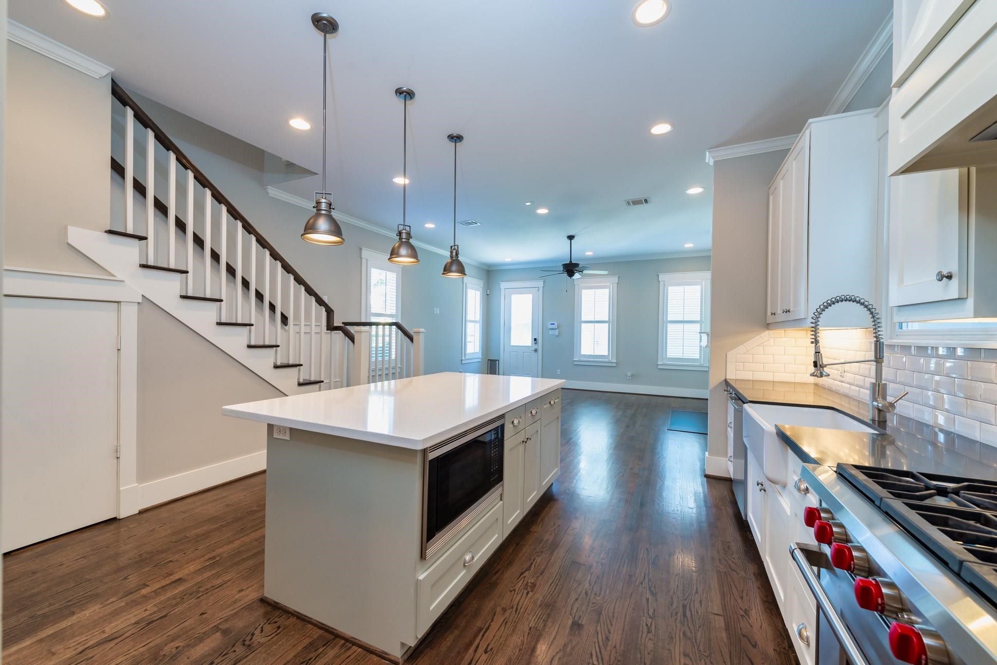 734 Allston Street, Unit B Houston, TX 77007 - Photo 7 of 28 The large island kitchen is a chef's dream. Offering a 6 burner gas stove, pot filler,Thermador refrigerator and more.