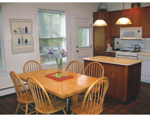 34 Manchester Road Brookline, MA 02446 - Photo 6 of 9 a dining room with furniture and a mirror