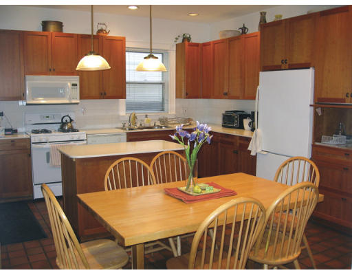 34 Manchester Road Brookline, MA 02446 - Photo 7 of 9 a kitchen that has a table and chairs in it