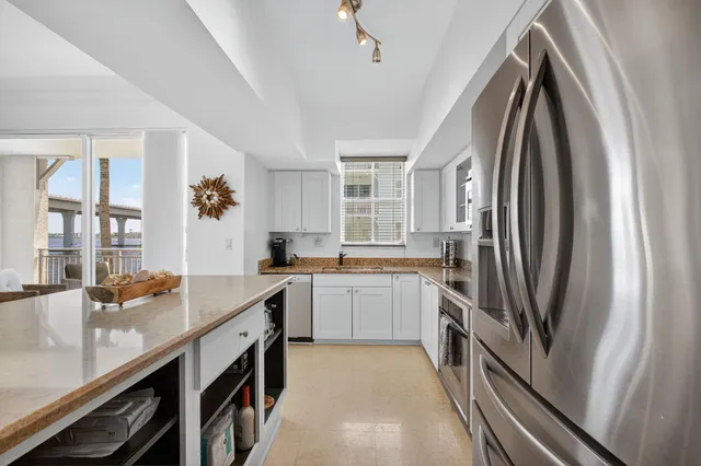 a bathroom with a sink a large mirror and a bathtub