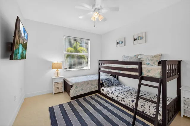 a balcony with furniture and a potted plant