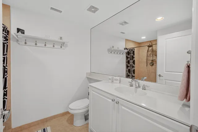 a view of a house with backyard sitting area and swimming pool