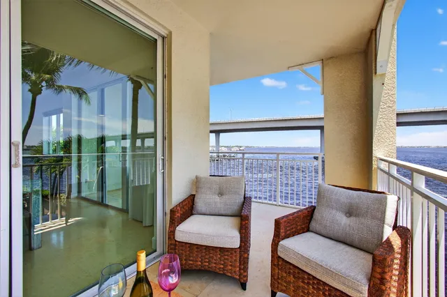 an aerial view of a balcony with chairs