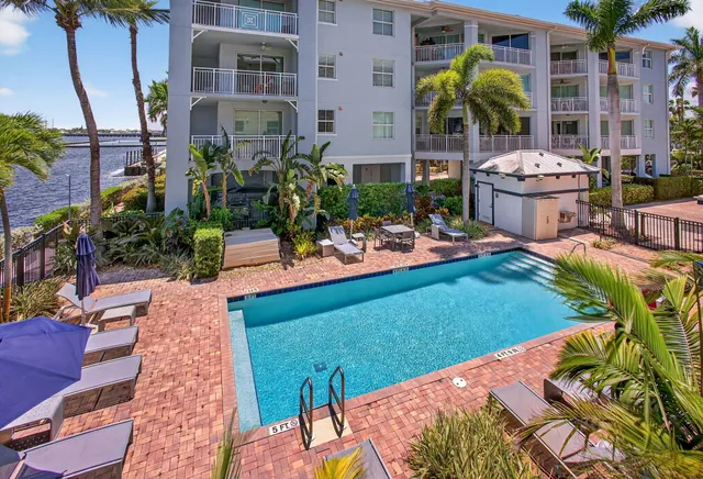 an aerial view of a house with a swimming pool