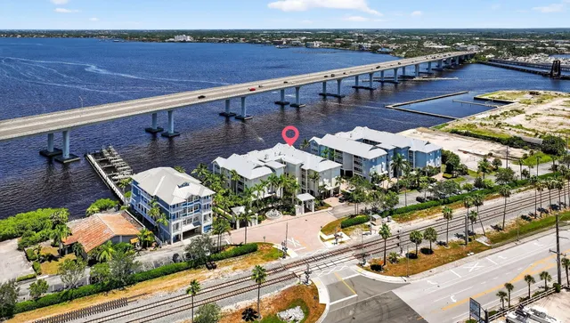 a balcony with swimming pool and lake view