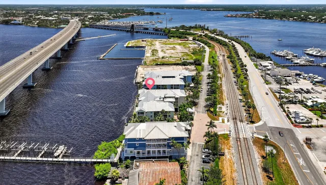 a view of a livingroom with furniture and a large window