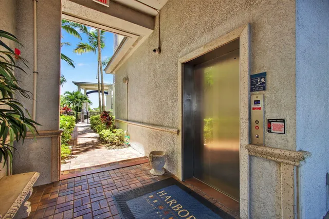 a dining room with furniture a chandelier and window