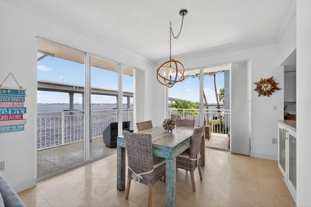 a kitchen with stainless steel appliances granite countertop a sink stove microwave and refrigerator