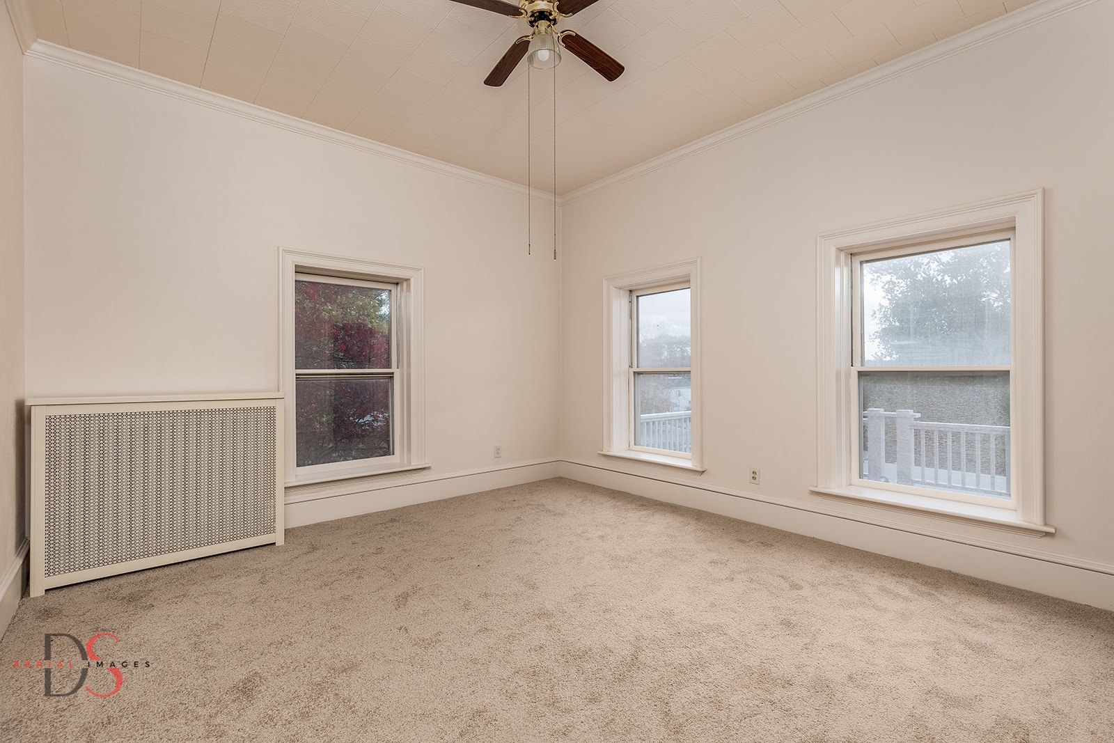 369 West Bluff Street Marseilles, IL 61341 - Photo 26 of 41 an empty room with windows and fan