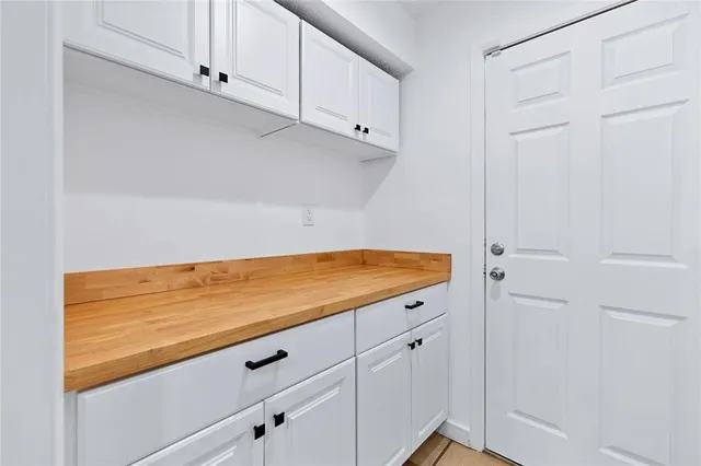 a view of room with cabinets