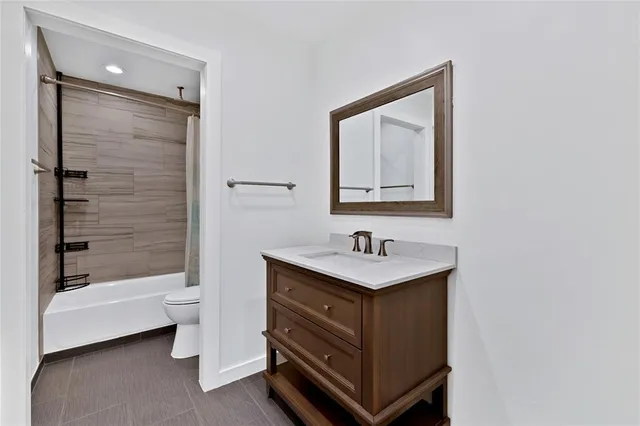 a bathroom with a toilet sink and a bathtub