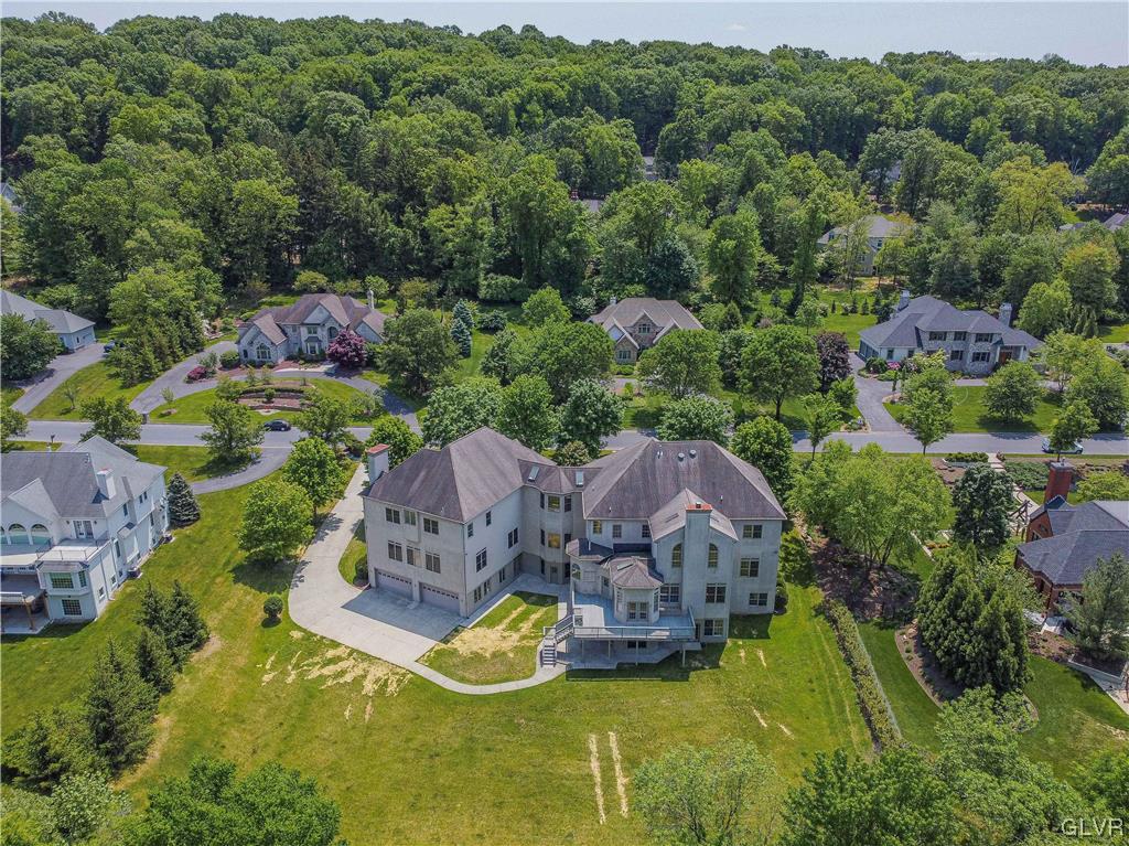 2175 Augusta Drive Center Valley, PA 18034 - Photo 47 of 50 an aerial view of a house with a garden and lake view